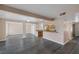 Open-concept living area boasts hardwood floors, recessed lighting, and a breakfast bar connecting to the kitchen at 401 Altamira Rd, Las Vegas, NV 89145