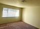 Comfortable bedroom with carpet and natural light at 4338 Caliente St # 15, Las Vegas, NV 89119