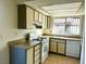 Kitchen with light-colored cabinets and gas range at 4338 Caliente St # 15, Las Vegas, NV 89119