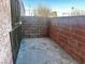 Enclosed patio with red brick wall at 4338 Caliente St # 15, Las Vegas, NV 89119