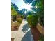 Scenic walkway bordered by lush greenery and decorative rock landscaping, perfect for a leisurely stroll at 4338 Caliente St # 15, Las Vegas, NV 89119