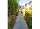 Inviting walkway surrounded by lush foliage, creating a serene and picturesque pathway to your destination at 4338 Caliente St # 15, Las Vegas, NV 89119