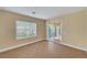 Well-lit bedroom with a window and sliding door leading to the outdoor patio at 4593 Weitzman Pl, Las Vegas, NV 89141