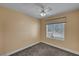 Cozy bedroom with neutral walls, ceiling fan, and window for natural light at 4593 Weitzman Pl, Las Vegas, NV 89141