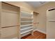 Spacious walk-in closet features custom shelving, rod system, and ample storage at 4593 Weitzman Pl, Las Vegas, NV 89141