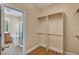 Walk-in closet near the bathroom features custom shelving and rod system at 4593 Weitzman Pl, Las Vegas, NV 89141