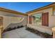 Home exterior featuring attractive red shutters on the windows, a well-maintained yard and manicured landscape at 4593 Weitzman Pl, Las Vegas, NV 89141