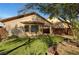 Beautiful home exterior showcasing manicured landscaping, healthy lawn, and desert plants at 4593 Weitzman Pl, Las Vegas, NV 89141