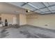 Spacious two car garage with bright lighting and clean, sealed concrete floor at 4593 Weitzman Pl, Las Vegas, NV 89141