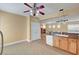 The kitchen features wooden cabinets, stainless steel appliances, and tile flooring at 4593 Weitzman Pl, Las Vegas, NV 89141