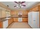 Bright kitchen featuring light wood cabinets and stainless steel appliances at 4593 Weitzman Pl, Las Vegas, NV 89141