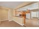 Open-concept kitchen featuring wood cabinetry and modern appliances at 4593 Weitzman Pl, Las Vegas, NV 89141