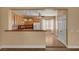 Bright kitchen featuring wood cabinets and open access to the dining area at 4593 Weitzman Pl, Las Vegas, NV 89141