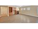 Open living area featuring a fireplace, built-in shelving, and an abundance of natural light through decorative windows at 4593 Weitzman Pl, Las Vegas, NV 89141