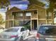 A two-story apartment building with stairs and covered walkways showing neutral paint and parking at 4696 Krissylouise Way, Las Vegas, NV 89121