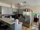 A functional kitchen with modern stainless steel appliances and a breakfast bar for easy meals at 4696 Krissylouise Way, Las Vegas, NV 89121