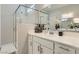 Bathroom featuring dual sinks, a glass-enclosed shower, and modern vanity at 4708 Mindful St, North Las Vegas, NV 89031