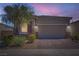 Charming single-story home with a brick driveway and well-maintained landscaping at 4708 Mindful St, North Las Vegas, NV 89031