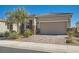 Single-story home boasts a brick driveway and desert landscaping for a clean, welcoming look at 4708 Mindful St, North Las Vegas, NV 89031