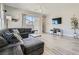 Bright living room showcasing modern decor, a comfortable couch, and plenty of natural light at 4708 Mindful St, North Las Vegas, NV 89031