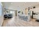 Spacious open-concept kitchen and living room with recessed lights and sliding glass doors to backyard at 4708 Mindful St, North Las Vegas, NV 89031