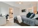 Primary bedroom with en-suite access, features a TV, and a desk for working at 4708 Mindful St, North Las Vegas, NV 89031