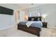 Comfortable primary bedroom featuring neutral paint, carpet, a TV, and window with coverings at 4708 Mindful St, North Las Vegas, NV 89031