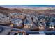 Stunning aerial view of a modern community showcasing stylish homes and well-maintained streets against a backdrop of city lights at 522 Riley Ridge Ct, Henderson, NV 89012