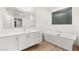 Bright bathroom featuring a soaking tub and vanity at 522 Riley Ridge Ct, Henderson, NV 89012