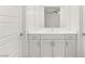 Modern bathroom featuring white cabinets, drawers, quartz countertops, and contemporary fixtures at 522 Riley Ridge Ct, Henderson, NV 89012