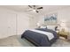 Staged bedroom with a ceiling fan and modern decor at 522 Riley Ridge Ct, Henderson, NV 89012