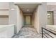 Inviting entryway featuring double doors, stone accents, and a well-lit walkway, creating an appealing first impression at 522 Riley Ridge Ct, Henderson, NV 89012