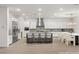 A spacious kitchen with a large island, stainless steel appliances, and a dining area at 522 Riley Ridge Ct, Henderson, NV 89012