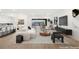 Bright, open-concept living room with modern furnishings and seamless flow to the kitchen at 522 Riley Ridge Ct, Henderson, NV 89012