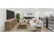 Upstairs living room features a couch, coffee table, tv, pool table and balcony at 522 Riley Ridge Ct, Henderson, NV 89012