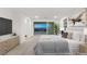 Main bedroom with a bed, dresser, TV, and a balcony overlooking the city skyline at 522 Riley Ridge Ct, Henderson, NV 89012