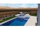 This backyard features a luxury pool and elevated lounge area with decorative rocks and landscaping at 522 Riley Ridge Ct, Henderson, NV 89012