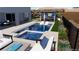 A beautifully rendered backyard pool and patio is the perfect space to relax outdoors at 522 Riley Ridge Ct, Henderson, NV 89012