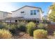 Home exterior featuring an enclosed backyard and covered patio at 524 Grand Cascade Pl, North Las Vegas, NV 89084