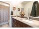 Bathroom boasts a dual sink vanity and decorative shower curtain in a stylish design at 524 Grand Cascade Pl, North Las Vegas, NV 89084