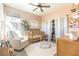 Charming Bedroom with pastel walls, a crib, and a comfortable chair, perfect for a new baby at 524 Grand Cascade Pl, North Las Vegas, NV 89084