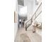 Inviting foyer with tile flooring, staircase, and stylish decor leading to living spaces at 524 Grand Cascade Pl, North Las Vegas, NV 89084