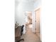 Bright hallway view with a desk, leading to a cozy Bedroom with crib and plush seating at 524 Grand Cascade Pl, North Las Vegas, NV 89084