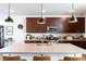 Kitchen featuring a large center island with bar seating and stainless steel appliances at 524 Grand Cascade Pl, North Las Vegas, NV 89084