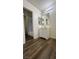 Bathroom showcasing a tiled shower and vanity with new fixtures and wood-look flooring at 567 Roxella Ln # D, Las Vegas, NV 89110