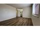 Bedroom featuring wood-look flooring and a doorway view to a bathroom at 567 Roxella Ln # D, Las Vegas, NV 89110