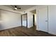 Bedroom with laundry closet, wood-look flooring and neutral paint scheme at 567 Roxella Ln # D, Las Vegas, NV 89110