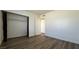 Bedroom featuring wood-look flooring and closet with sliding doors at 567 Roxella Ln # D, Las Vegas, NV 89110
