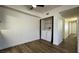 Bright bedroom featuring a ceiling fan and convenient closet with laundry appliances at 567 Roxella Ln # D, Las Vegas, NV 89110