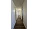 Bright hallway featuring wood-look flooring and crisp, white trim at 567 Roxella Ln # D, Las Vegas, NV 89110